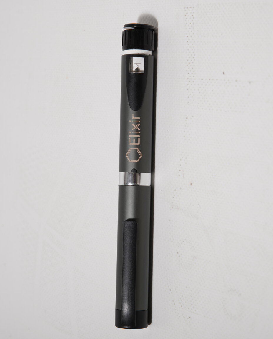 Peter, founder of Elixir, holding the Elixir pen