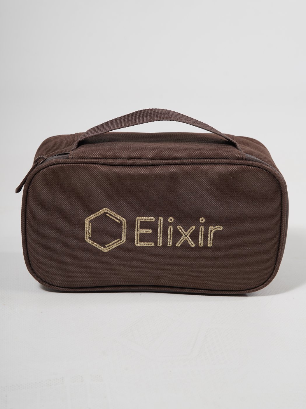 The Elixir bag, closed with its handle
