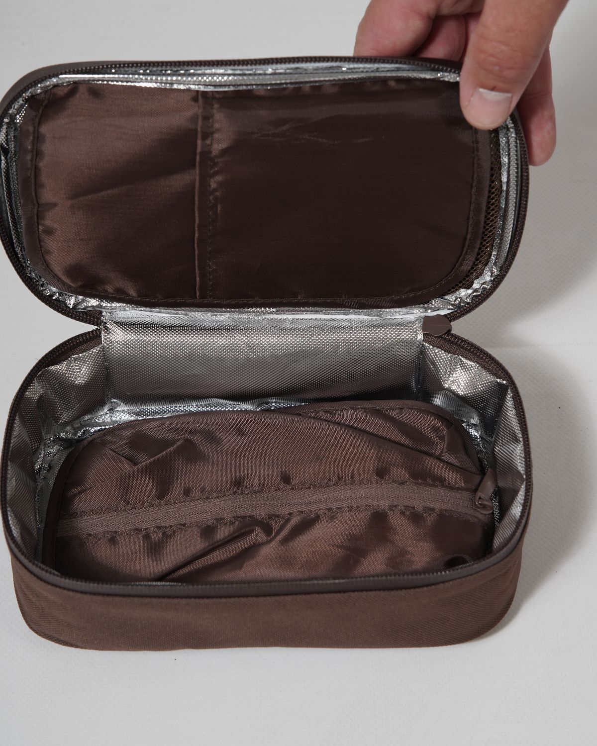 The Elixir case open, showing the foil-lined interior